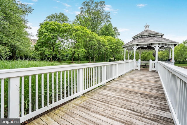 wooden deck featuring a gazebo