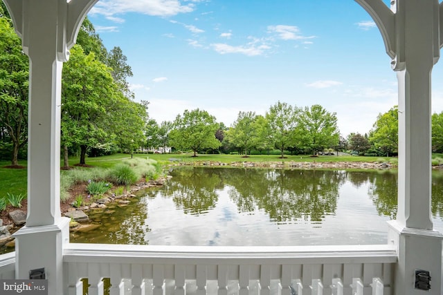 water view with a tree filled landscape