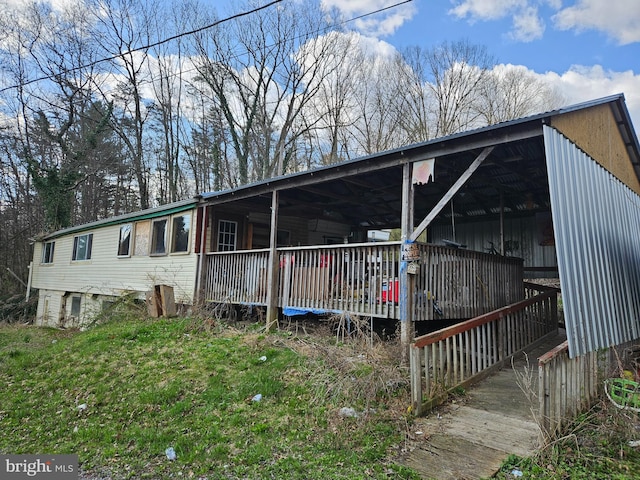 exterior space featuring a wooden deck