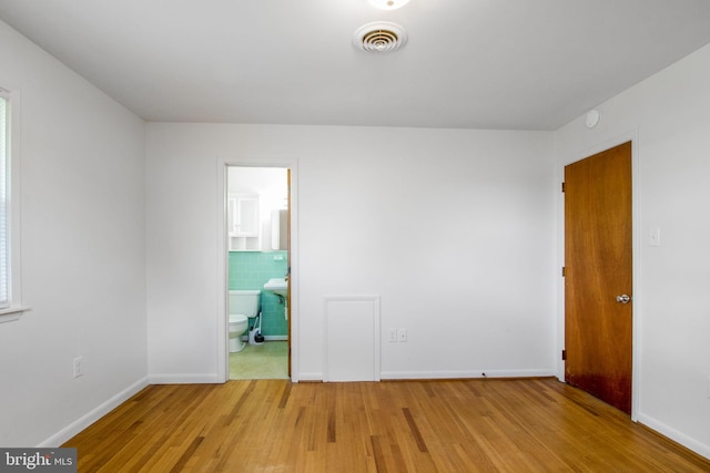 7906 Longmeadow Dr, Frederick, MD 21701 - empty room with light wood finished floors, baseboards, and visible vents