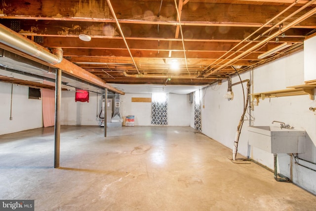 7906 Longmeadow Dr, Frederick, MD 21701 - unfinished basement with heating unit and a sink