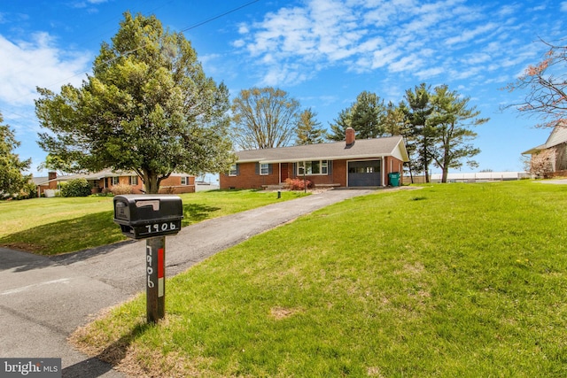 7906 Longmeadow Dr, Frederick, MD 21701 - ranch-style home with an attached garage, a front lawn, aphalt driveway, and a chimney