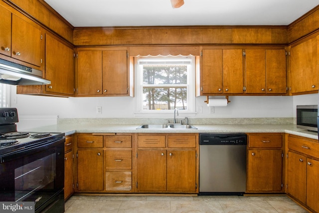 7906 Longmeadow Dr, Frederick, MD 21701 - kitchen featuring under cabinet range hood, stainless steel appliances, light countertops, and a sink