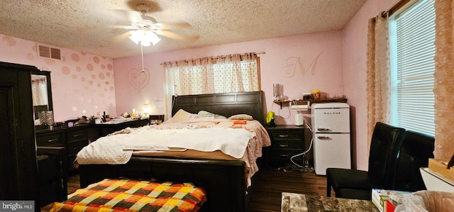 12 Deborah Dr, Millville, NJ 08332 - bedroom featuring freestanding refrigerator, a textured ceiling, wood finished floors, multiple windows, and ceiling fan