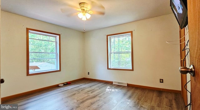 12 Deborah Dr, Millville, NJ 08332 - empty room with plenty of natural light, wood finished floors, and baseboards