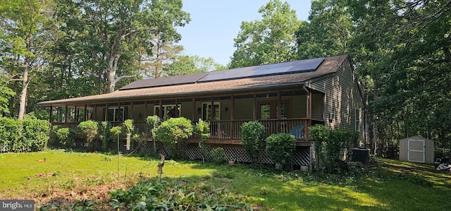 12 Deborah Dr, Millville, NJ 08332 - view of front of home featuring a front yard, roof mounted solar panels, a porch, and a shingled roof