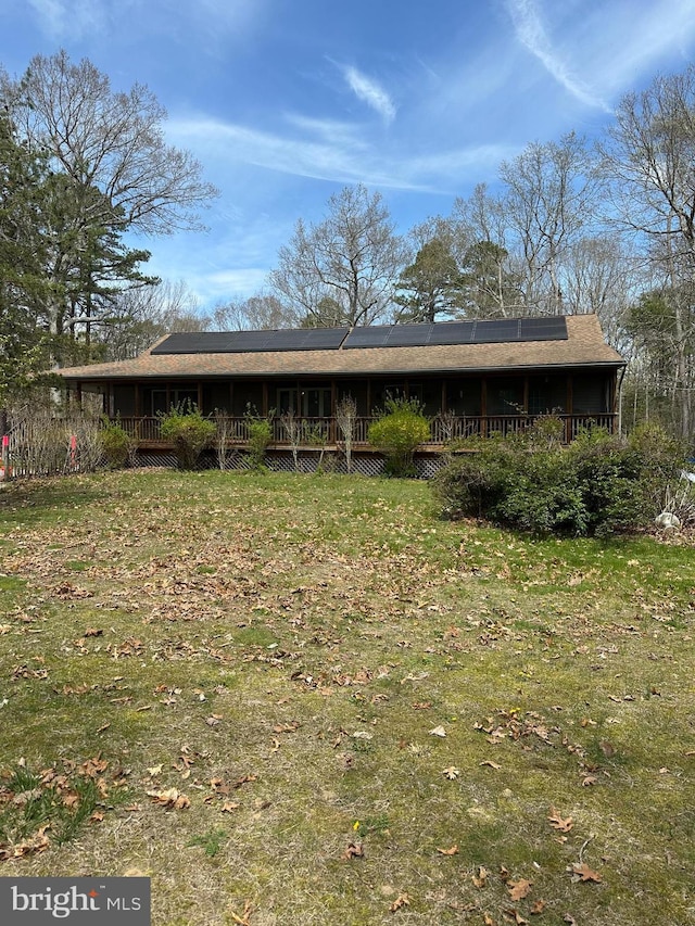 12 Deborah Dr, Millville, NJ 08332 - back of house with solar panels, a yard, and a wooden deck