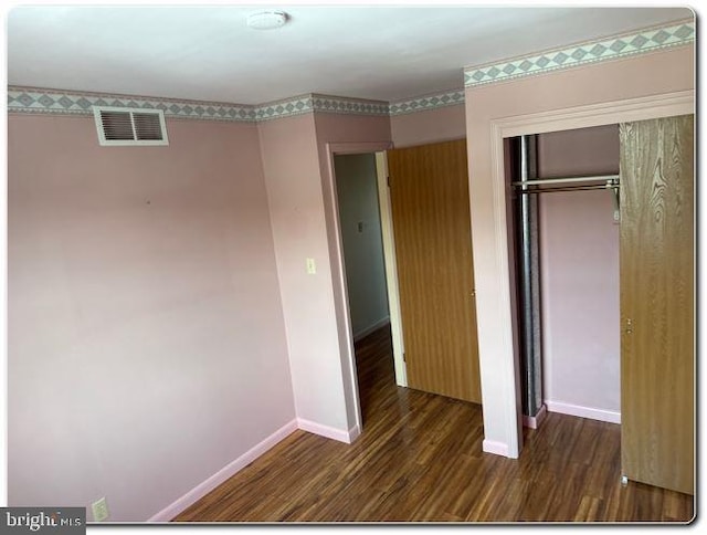 28 Lincoln Pl, Whitehall, PA 18052 - unfurnished bedroom with baseboards, wood finished floors, visible vents, and a closet