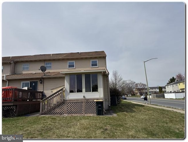 28 Lincoln Pl, Whitehall, PA 18052 - rear view of house featuring a wooden deck and a lawn