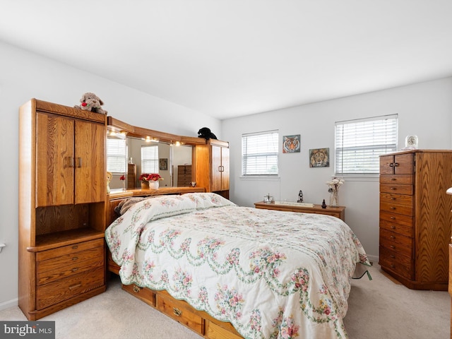 carpeted bedroom with baseboards