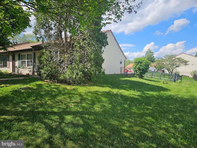 view of yard featuring fence