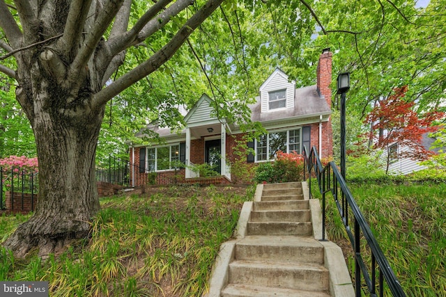 4260 25th St N, Arlington, VA 22207 - view of front of property with brick siding, a chimney, fence, and stairs