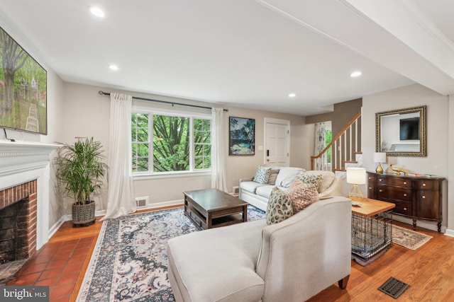 4260 25th St N, Arlington, VA 22207 - living room with stairs, recessed lighting, a fireplace, and visible vents