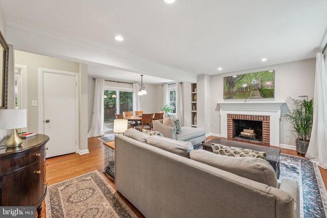 4260 25th St N, Arlington, VA 22207 - living area featuring light wood finished floors, a fireplace, and recessed lighting