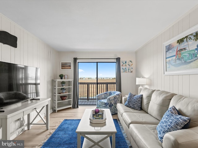 674 94th St Unit 154, Ocean City, MD 21842 - living room with wooden walls and light wood-style flooring