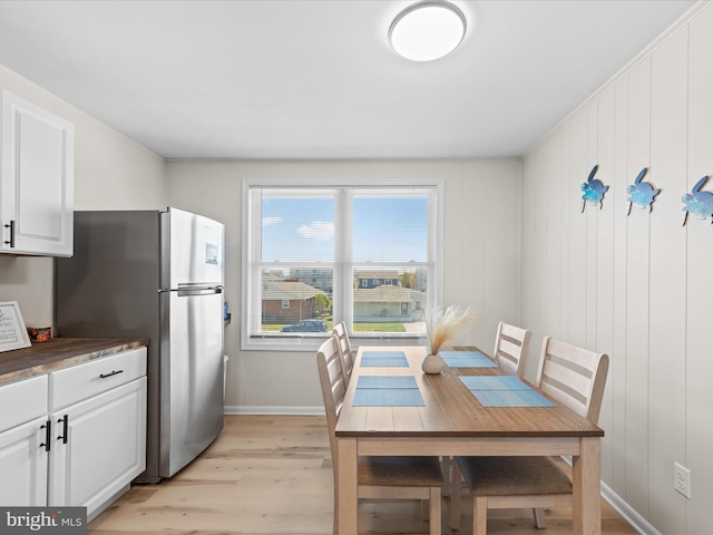 674 94th St Unit 154, Ocean City, MD 21842 - dining room featuring baseboards and light wood-style flooring
