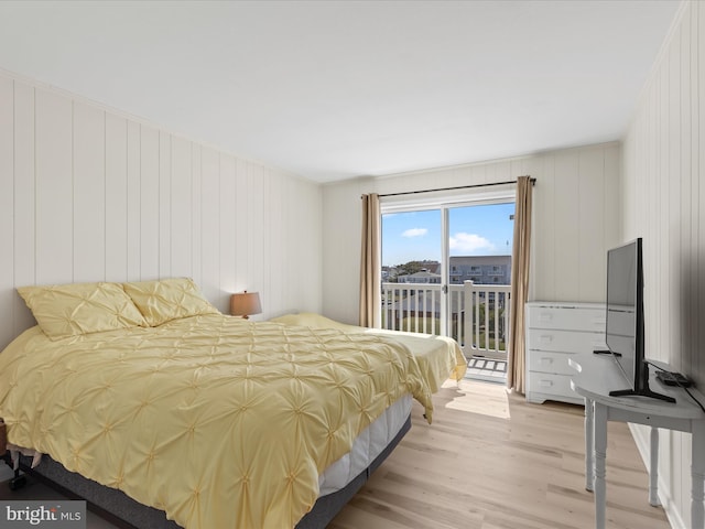 674 94th St Unit 154, Ocean City, MD 21842 - bedroom featuring light wood-style flooring and access to exterior
