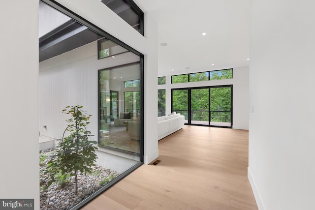 6018 Woodland Ter, Mclean, VA 22101 - hallway featuring wood finished floors, a high ceiling, and recessed lighting