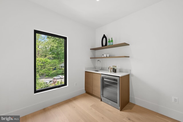 6018 Woodland Ter, Mclean, VA 22101 - indoor wet bar with beverage cooler, light wood-type flooring, and baseboards
