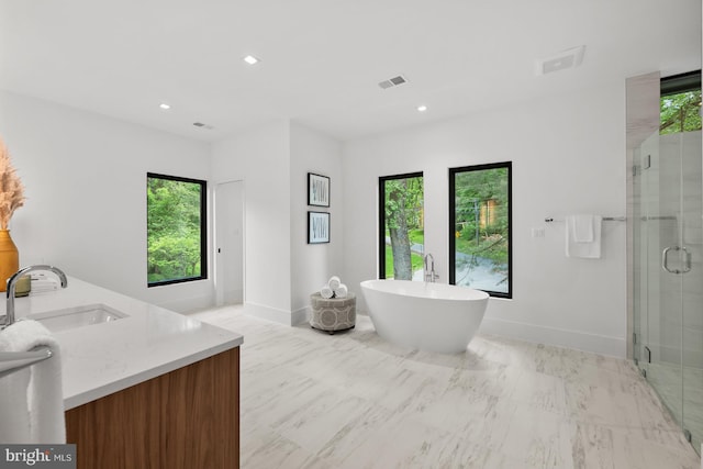 6018 Woodland Ter, Mclean, VA 22101 - bathroom with healthy amount of natural light, a stall shower, baseboards, and recessed lighting