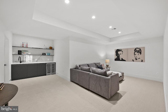 6018 Woodland Ter, Mclean, VA 22101 - living room with wet bar, a tray ceiling, light carpet, wine cooler, and recessed lighting