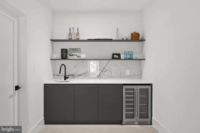 6018 Woodland Ter, Mclean, VA 22101 - indoor wet bar featuring beverage cooler and baseboards