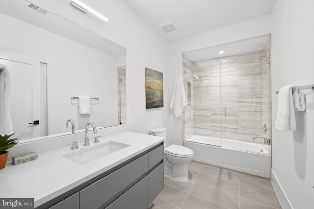 6018 Woodland Ter, Mclean, VA 22101 - bathroom featuring tile patterned flooring, vanity, toilet, washtub / shower combination, and baseboards