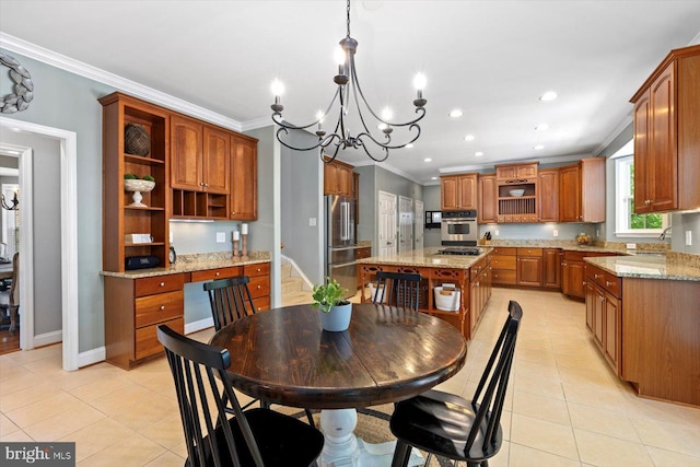 dining room featuring an inviting chandelier, ornamental molding, and light tile patterned floors