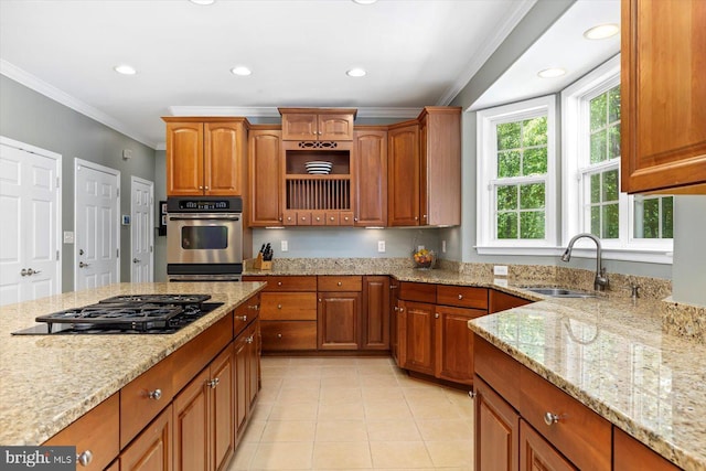 kitchen featuring crown molding, light tile patterned flooring, light stone countertops, a sink, and black gas cooktop