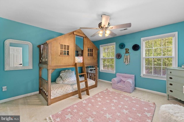bedroom with carpet flooring, a ceiling fan, baseboards, and visible vents