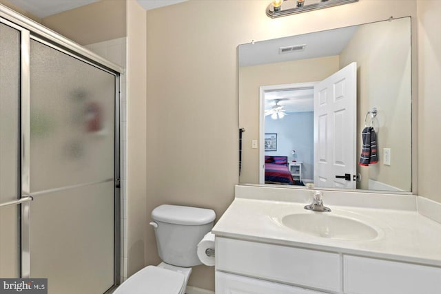 ensuite bathroom featuring visible vents, a stall shower, vanity, toilet, and ensuite bathroom
