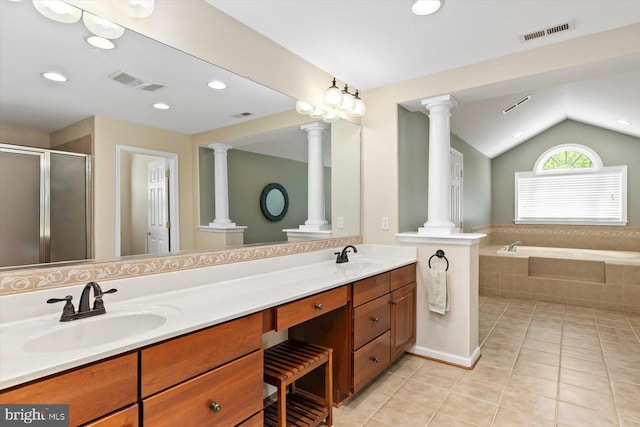 bathroom with a sink, lofted ceiling, ornate columns, and visible vents