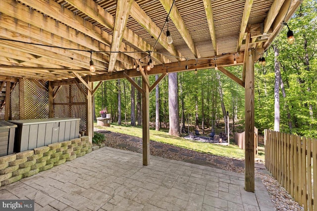 view of patio featuring fence