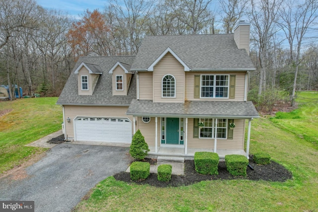 519 Squawigm Rd, Dover, DE 19901 - traditional home featuring a chimney, a front lawn, aphalt driveway, a porch, and roof with shingles