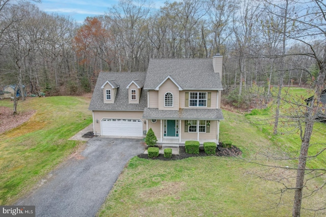 519 Squawigm Rd, Dover, DE 19901 - traditional-style home with a chimney, a front lawn, aphalt driveway, a shingled roof, and covered porch