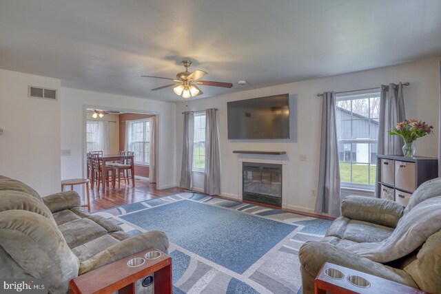519 Squawigm Rd, Dover, DE 19901 - living room featuring plenty of natural light, a ceiling fan, visible vents, and baseboards