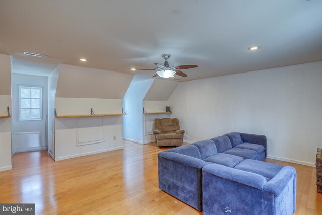 519 Squawigm Rd, Dover, DE 19901 - living room with lofted ceiling, visible vents, a ceiling fan, baseboards, and light wood-style flooring