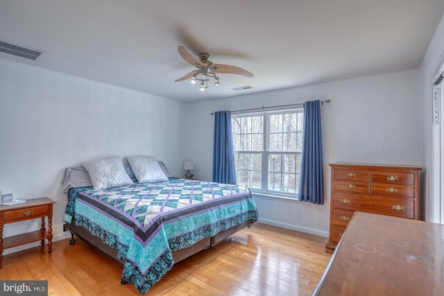 519 Squawigm Rd, Dover, DE 19901 - bedroom with baseboards, visible vents, and light wood-style floors
