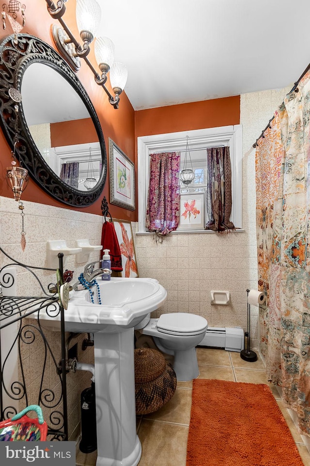 full bathroom featuring a baseboard radiator, tile walls, toilet, tile patterned flooring, and a shower with shower curtain