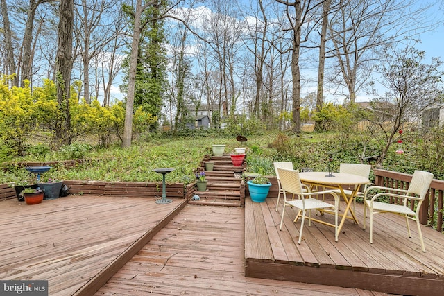 wooden deck with outdoor dining space