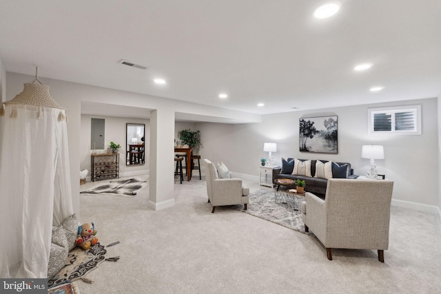 carpeted living room featuring recessed lighting and baseboards