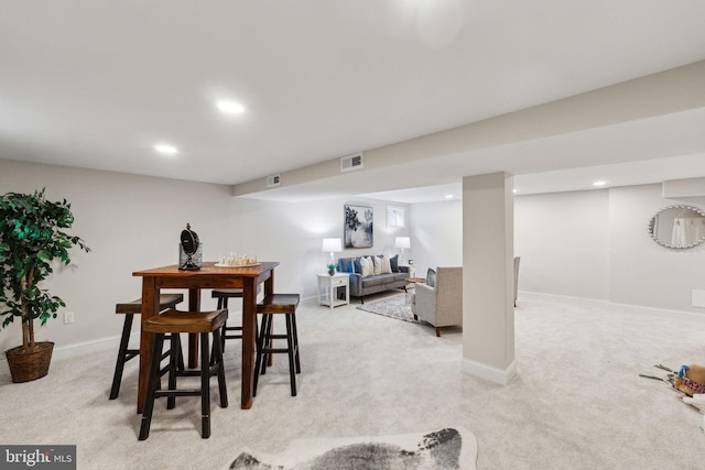 dining area with light colored carpet, baseboards, and recessed lighting