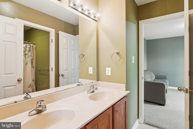 5900 Union Ridge Dr, Adamstown, MD 21710 - bathroom with double vanity, baseboards, and connected bathroom