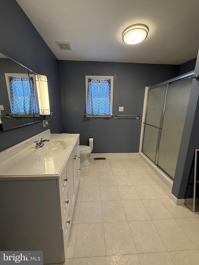 bathroom featuring a shower stall, tile patterned flooring, visible vents, toilet, and vanity