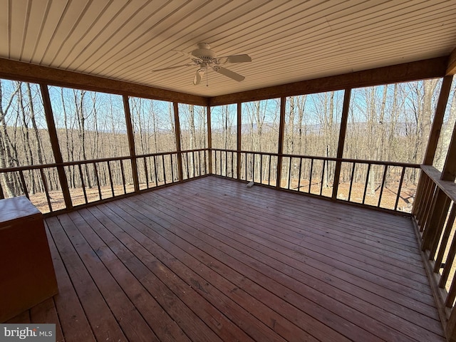 wooden deck featuring a ceiling fan