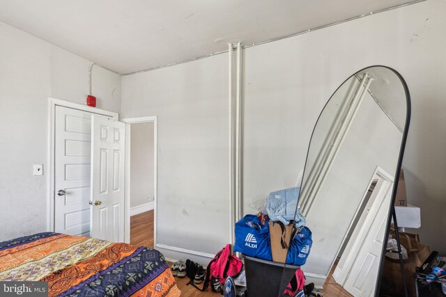 bedroom featuring wood finished floors