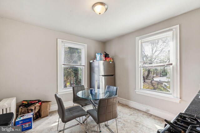 dining area featuring baseboards