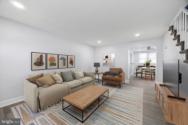 1328 Wycombe Ave, Darby, PA 19023 - living room with baseboards, wood finished floors, arched walkways, and recessed lighting