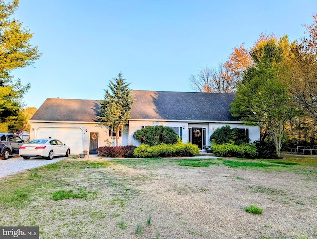 61 Perry Rd, Woodbine, NJ 08270 - ranch-style house featuring gravel driveway, roof with shingles, a front yard, and a garage