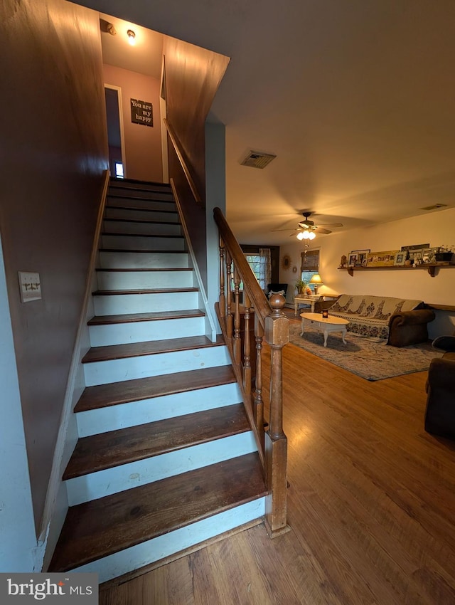 61 Perry Rd, Woodbine, NJ 08270 - staircase with visible vents, a ceiling fan, and wood finished floors